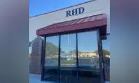 Here's a short alt tag for the image: `RHD building exterior`